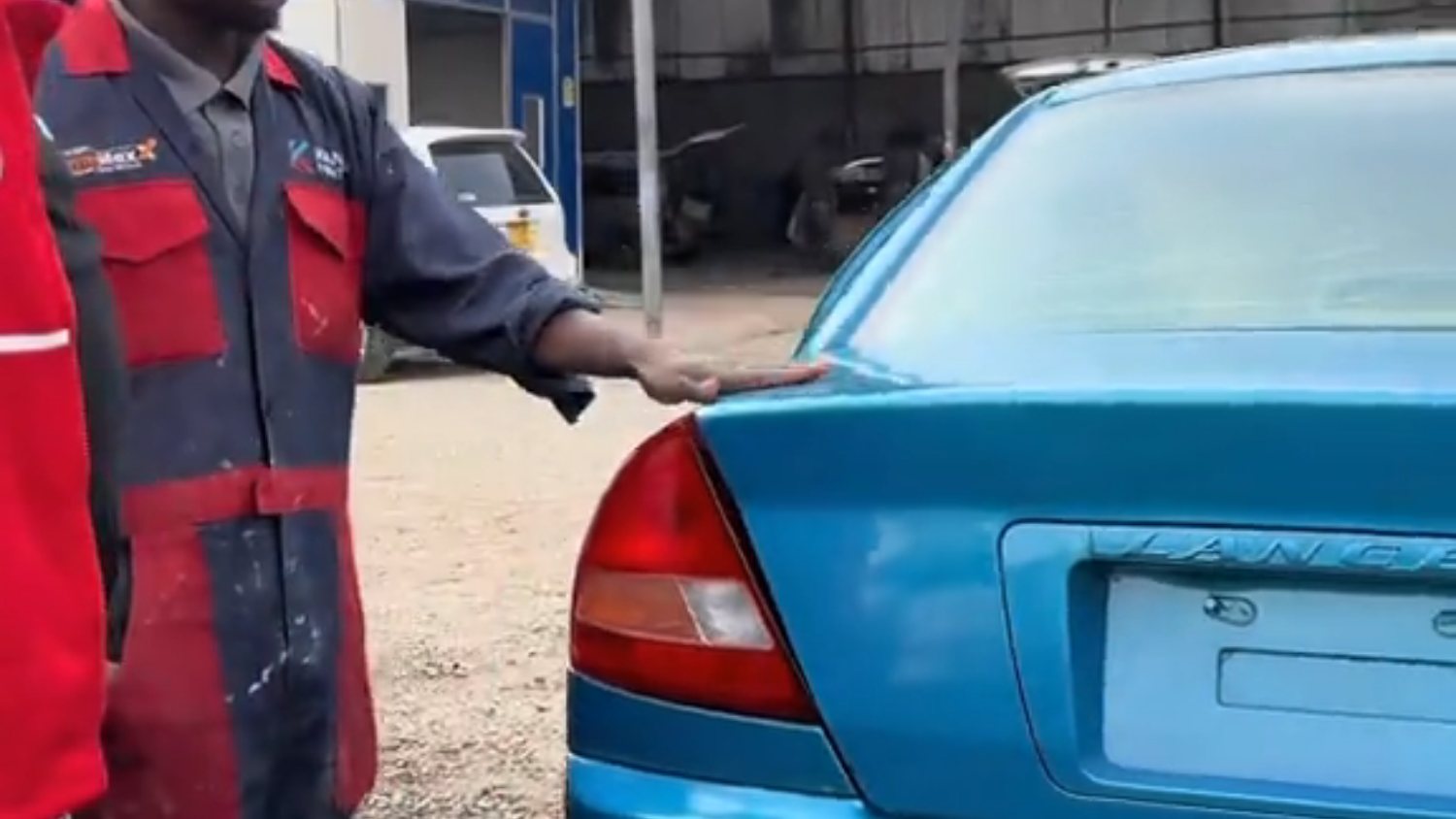 Evolve Motors technician working on a customer vehicle in Ruiru